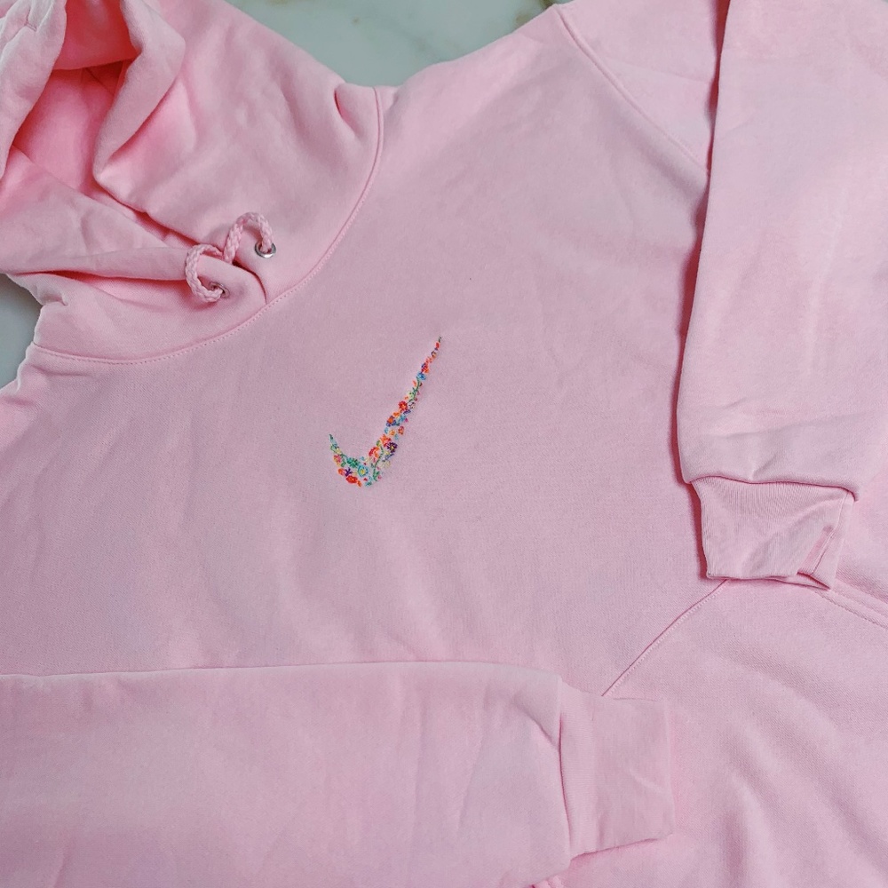 Pink hoodie with swoosh flower embroidery